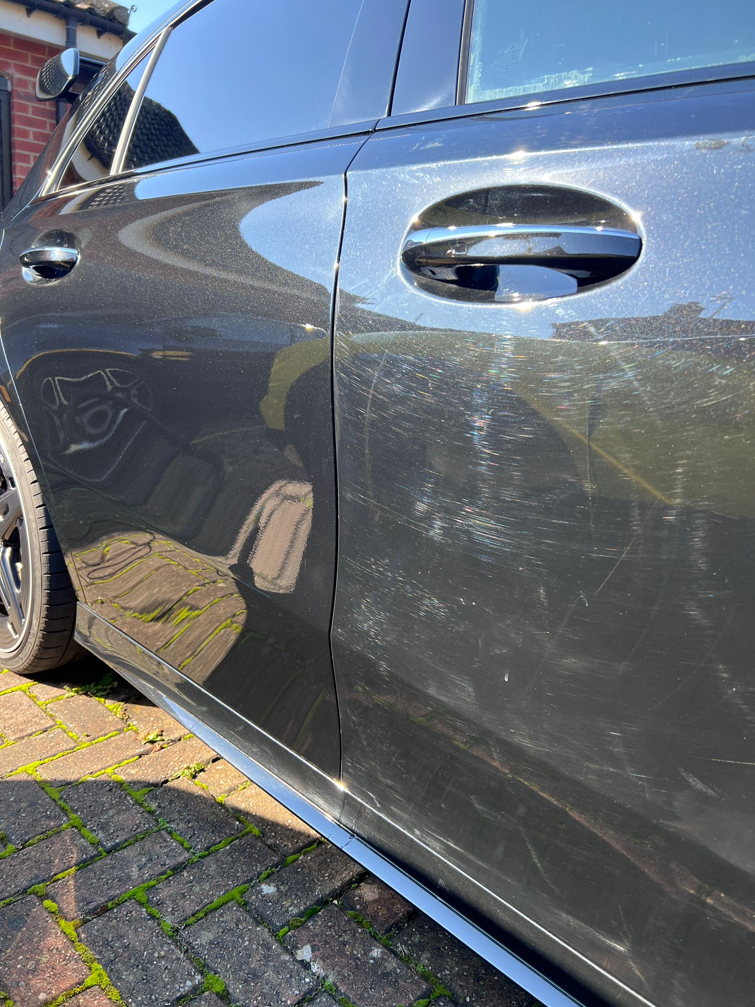 Close view of paint before correction, showing visible swirl marks